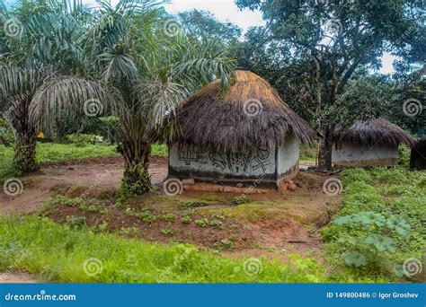 Traditional Thatched Round Mud And Clay Huts In Rural Village On The