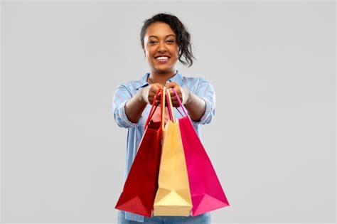 Premium Photo Happy African American Woman With Shopping Bags