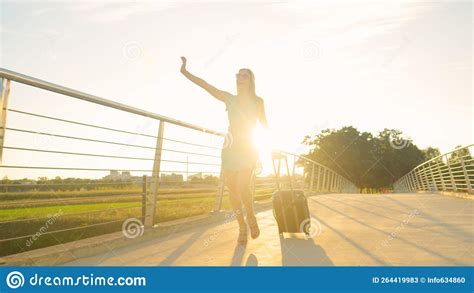 LENS FLARE Gorgeous Woman In Heels Walks Across An Overpass With A