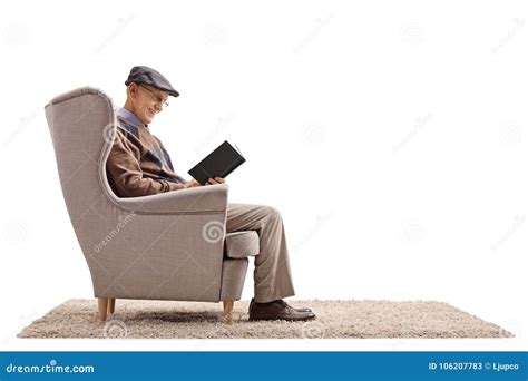 Elderly Man Seated In An Armchair Reading A Book Stock Image Image Of