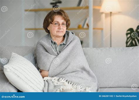 Pensive Thoughtful Middle Aged Lady Looking Away Sit Alone At Home Feel