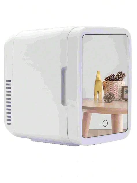 Un Mini Refrigerador Blanco Con Espejo De Maquillaje Y Adaptador De