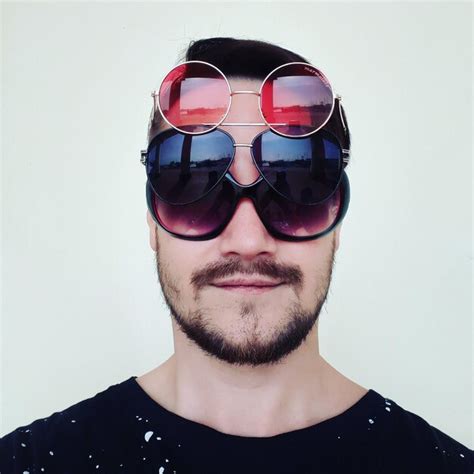 Premium Photo Portrait Of Young Man Wearing Sunglasses Against White Wall