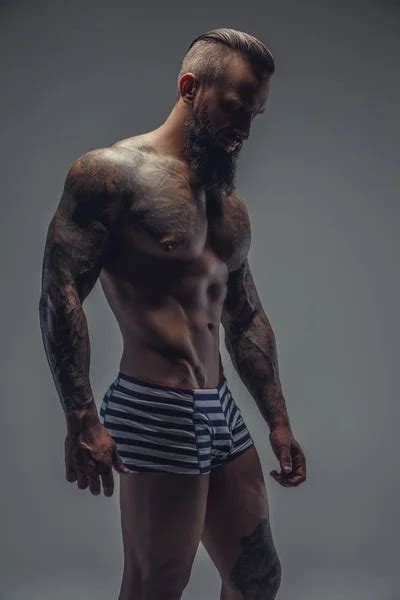 Tattooed Muscular Man Stock Photo Fxquadro