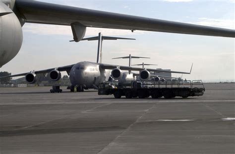 A 60K Loader Moves By A Line Of C 17 Globemaster IIIs Waiting To Launch