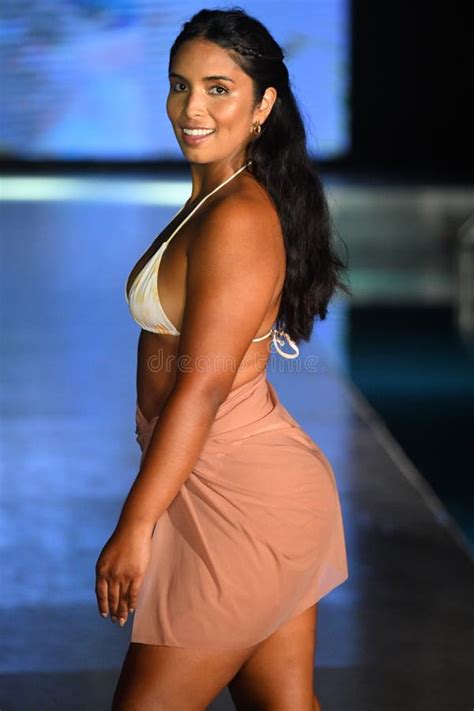 A Model Walks The Runway For Almost Naked Swim Show Editorial Photography Image Of Podium