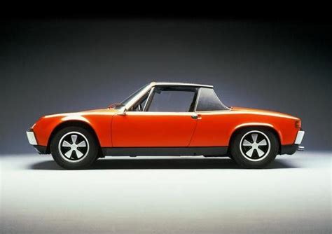 An Orange Sports Car Is Shown In This Image