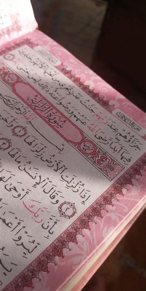 An Open Pink Book With Arabic Writing On It S Cover Sitting On A Table