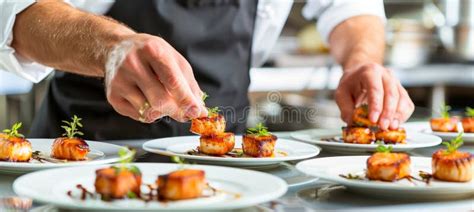 Fine Dining Chef Cooking Grilled Fish Fillet In Creamy Lemon Butter Or