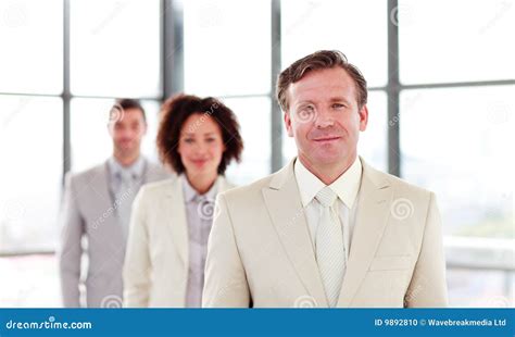 Mature Businessman Leading A Team Stock Photo Image Of Optimistic