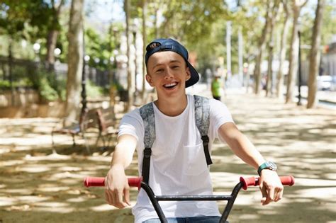 Free Photo | Young boy riding a BMX bike in park