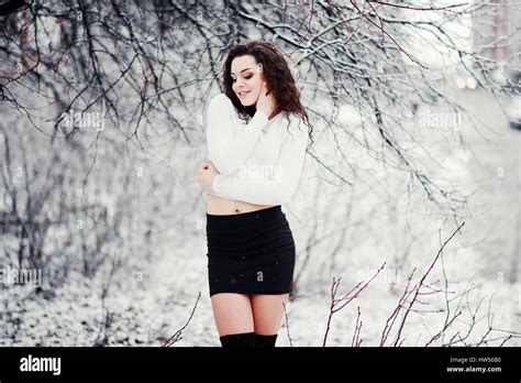 Curly Brunette Girl Background Falling Snow Wear On Black Mini Skirt And Wool Stockings Model
