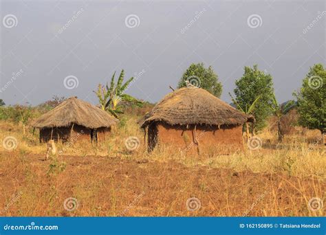 A Traditional Poor African Village In Uganda Made Of Earthenware Round