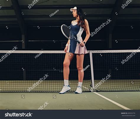 Sexy Brunette Female Tennis Player Posing Stock Photo