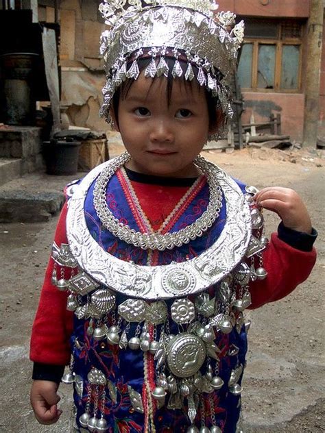 Miao Girl Hmong Walking In The Narrow Streets Of Her Village