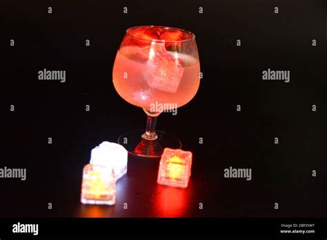 Red Bright Glowing Ice Cubes That Float In A Delicious Frosted White