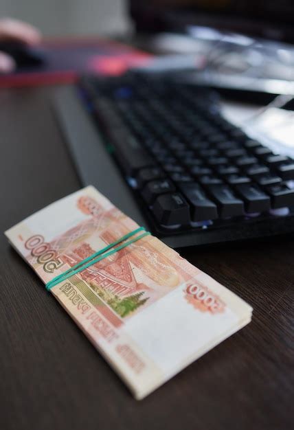 Premium Photo | Russian money above the black computer keyboard remote ...