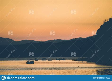 Sunset over Lake Ohrid stock photo. Image of colorful - 148491176