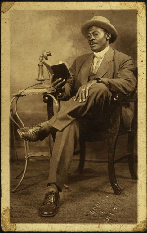 African American Man Reading A Book Indicator Of Literacy African