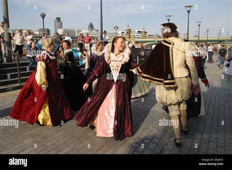 Performers In Elizabethan Costume Dance Outside Shakespeares Globe Theatre London England Uk