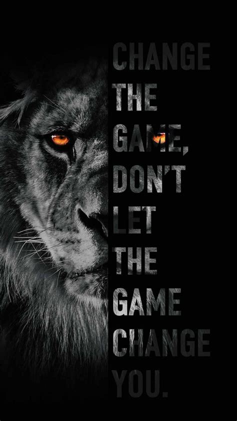 a lion with orange eyes and the words change the game, don't let the game change you