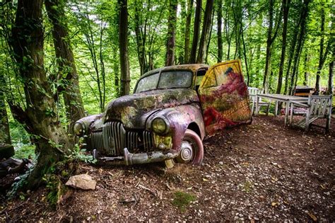 Premium Photo Abandoned Car In Forest