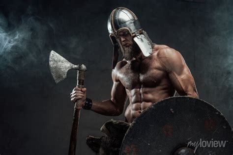 Armoured And Naked Viking Posing With Axe And Shield In Smoke