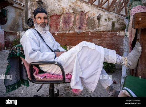 Portrait Of A Muslim Man Sitting On A Chair In The Tetouan Tanneries