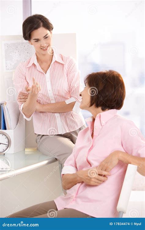 Coworkers Talking In Office Stock Photo Image Of Female Cooperating