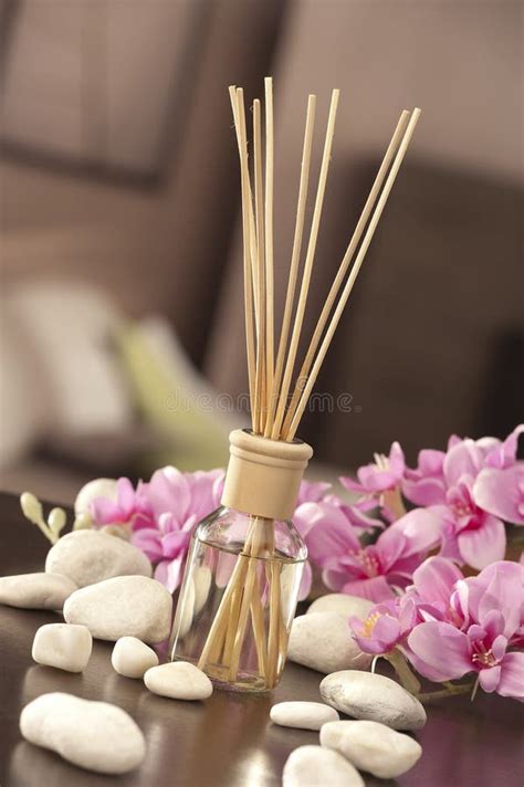 Air Freshener Sticks At Home With Flowers And Ou Of Focus Background