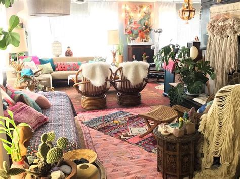 A Living Room Filled With Lots Of Furniture And Plants On Top Of