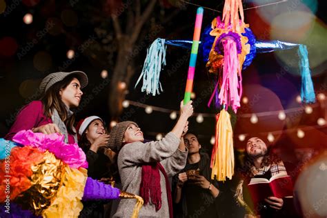 Posada Mexicana Mexican Friends Breaking A Pi Ata And Celebrating