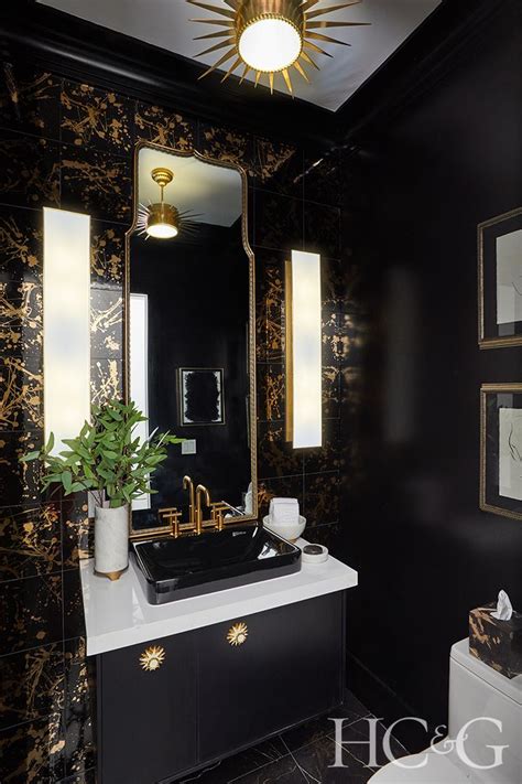 Glamorous Powder Room With Black And Gold Accents