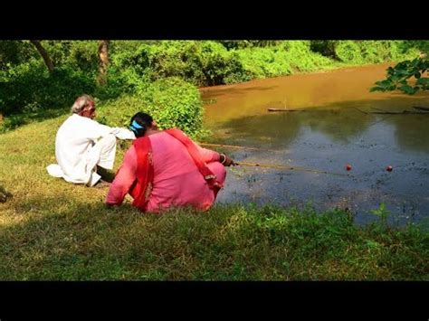 Hook Fishing Lady Fishing With Hook In Village Pond With Her