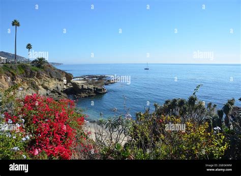 Scenic Landscape With A Sailing Boat Overlooking The Pacific Ocean In