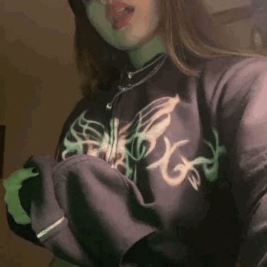 A Woman With Green Paint On Her Face