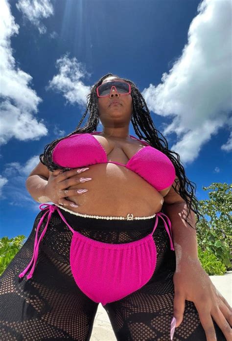 Lizzo Paired Her String Bikini With Fishnet Stockings And Pearls