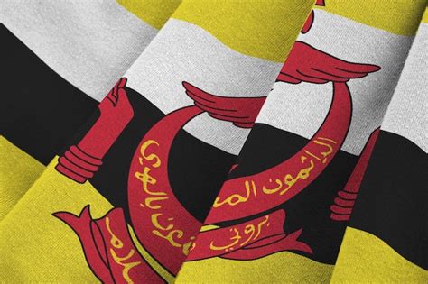 Premium Photo Brunei Darussalam Flag With Big Folds Waving Close Up