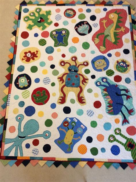 An Image Of A Colorful Quilt With Monsters On It