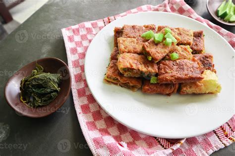 Martabak Telor or Murtabak Telur or mutabbaq. Savory pan-fried pastry ...