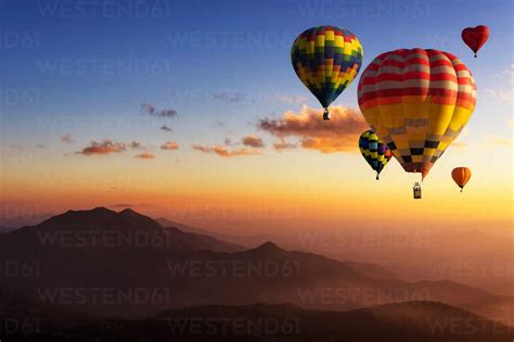 Hot Air Balloons Flying In Sky During Sunset stock photo