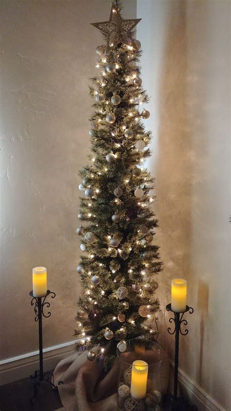 Cashmere pencil Christmas tree decorated with metal colored bulbs ...