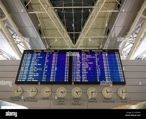 Airport flight schedule board Stock Photo - Alamy