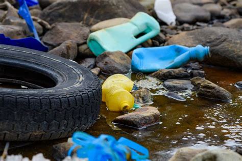 Environmental Pollution Rubber Tire With Plastic Waste Stock Photo