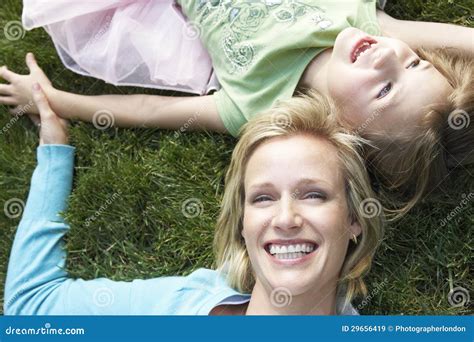 Mother And Daughter Lying On Grass Stock Image Image Of Person Angle