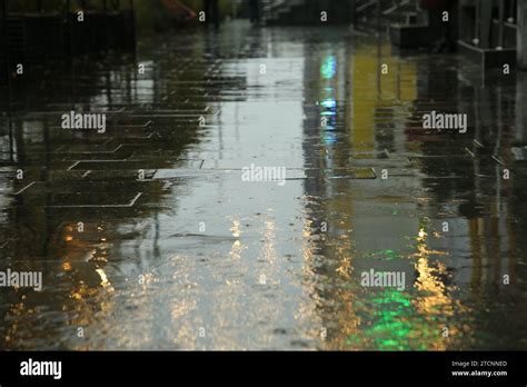 Pavement With Puddles On City Street After Rain Stock Photo Alamy