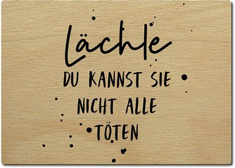 Interluxe Postkarte aus Holz Lächle du kannst sie nicht alle töten