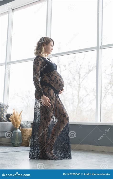 Pregnant Woman In A Beautiful Lace Dress Holds Belly Stock Image Image Of Expectant Bump