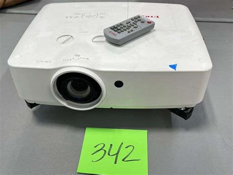 EIKI PROJECTOR W/ REMOTE & POWER CORD - Earl's Auction Company