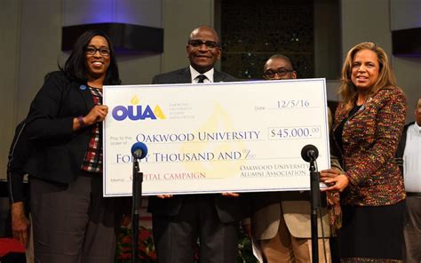 A check from representatives of the Oakwood University Alumni ...